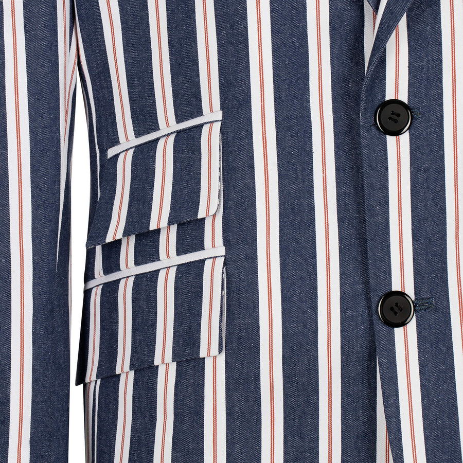 Close-up of a striped shirt with vertical blue, red, and white stripes on a white background.