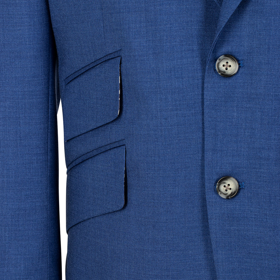 Close-up of a blue suit jacket with buttons and pocket details.