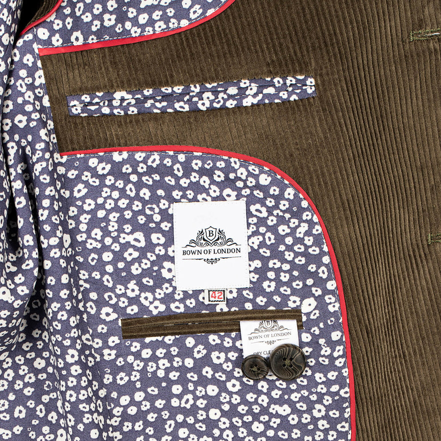 Close-up of a jacket with floral pattern and 'Town of London' label.
