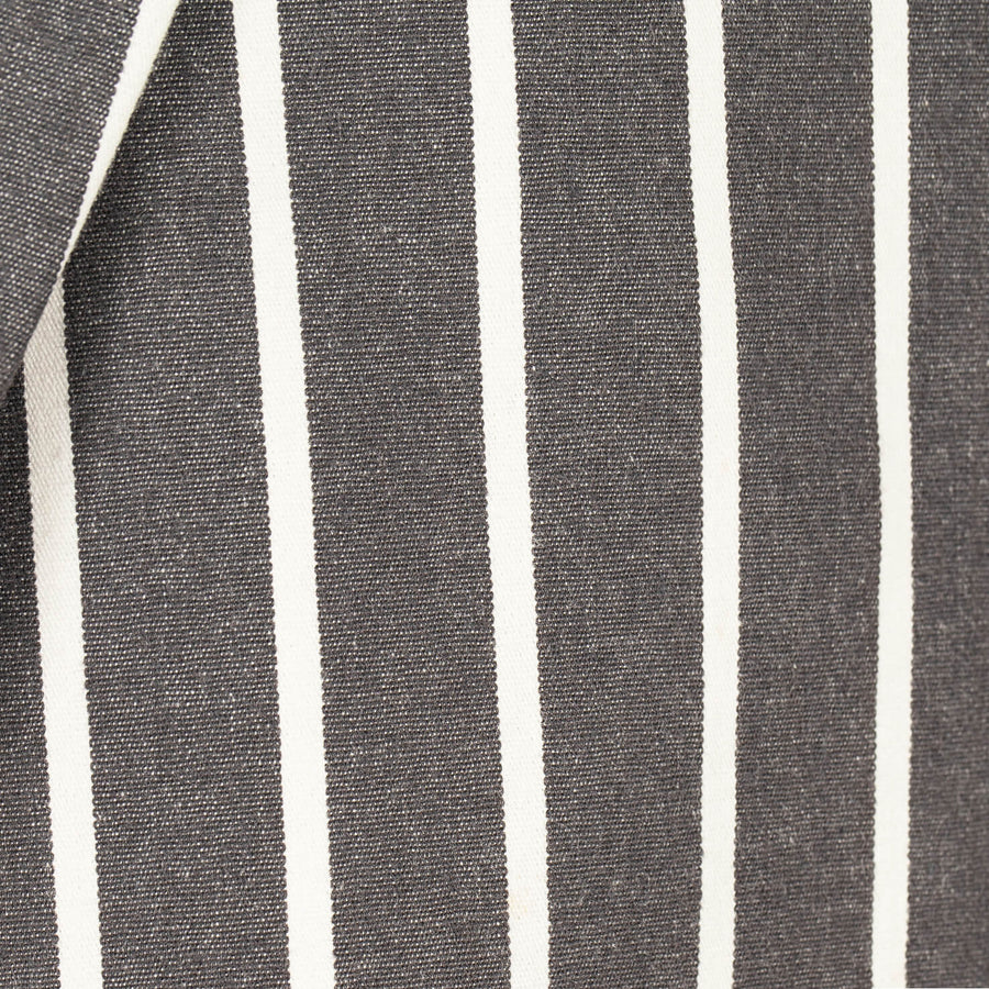 Close-up of a fabric with black and white vertical stripes.