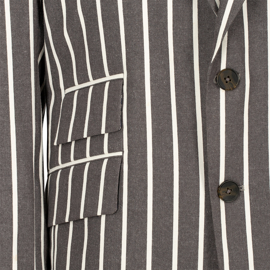 Close-up of a gray and white striped shirt with button details