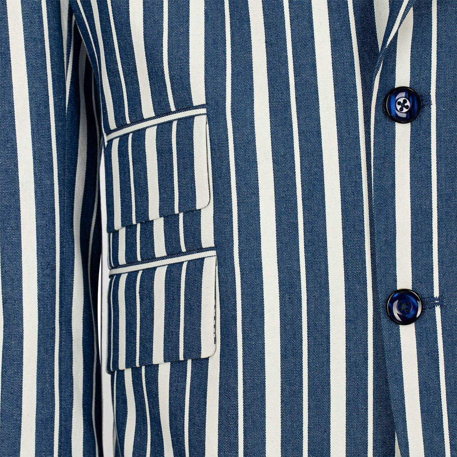 Close-up of a blue and white striped shirt with buttons and pockets.