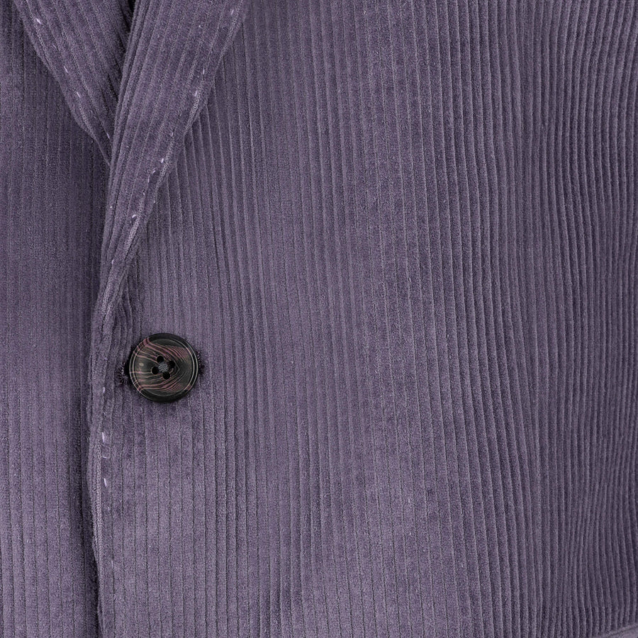 Close-up of a textured purple fabric with a button