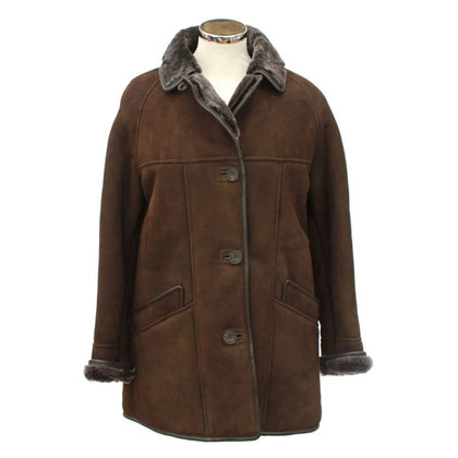 Brown suede coat with fur trim on a mannequin against a white background