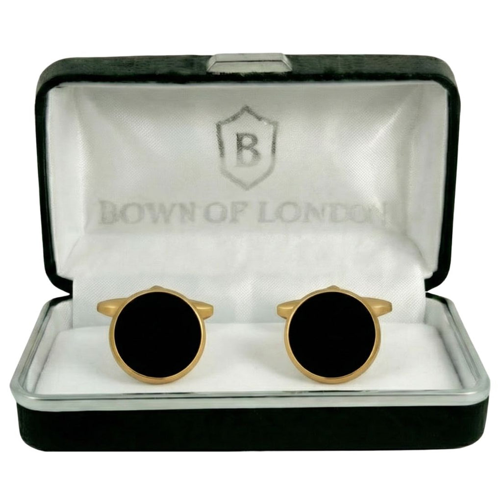 Gold and black cufflinks in a 'Bown of London' box. Bown of London