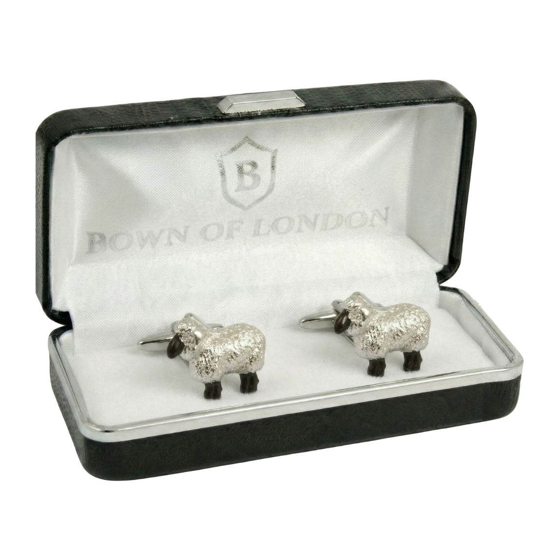 Cufflink shaped like a sheep on a white shirt cuff. Bown of London