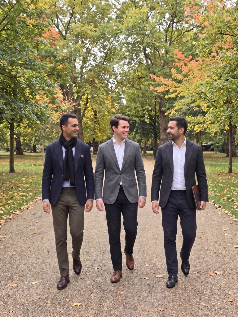 Windsor black silk scarf worn with a navy blazer on an autumn walk