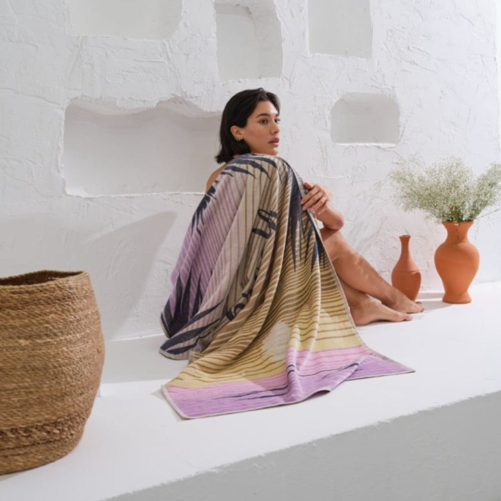 Add a touch of elegance to your beach look with our stunning Breath patterned organic towel for women.